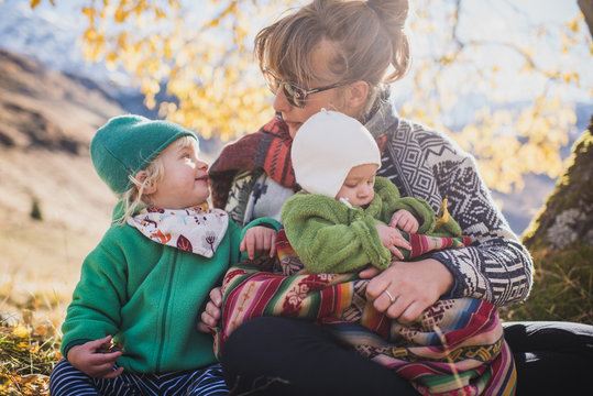 mother and daughters in the mountains