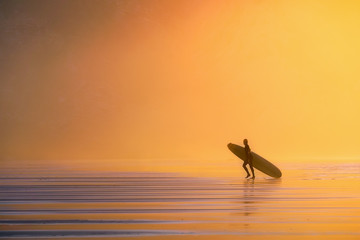surfer at the sunset
