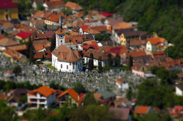 Fototapeta na wymiar European medieval city view. Miniature tilt shift lens effect