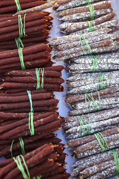 Bundles and rows of saucisson on market stall, St Tropez, Cote d'Azur, France