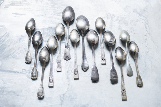 Studio shot, overhead view of teaspoons in staggered row