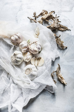 Studio shot, overhead view of garlic bulbs on muslin