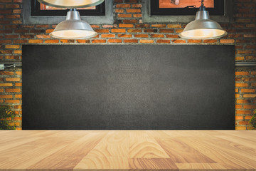 wood frame blackboard backgrounds with wood table top in the kitchen for product display , menu...