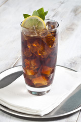 Alcohol cocktail with ice cubes.