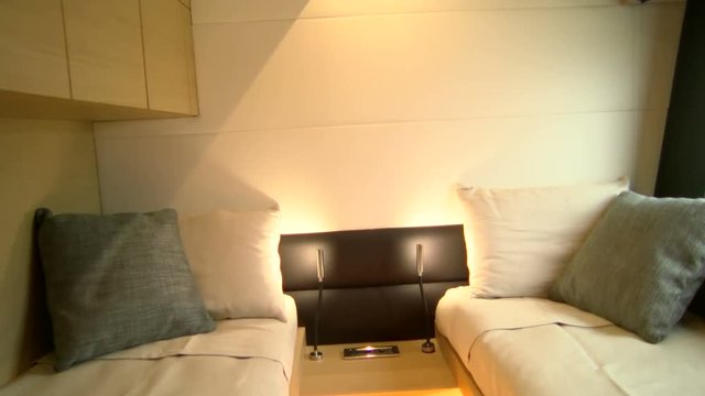 Twin beds in the cabin of a luxury yacht.