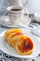 Breakfast with yeast pancakes, selective focus
