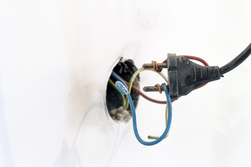 Badly wired plug showing bad and wrong and dangerous connection