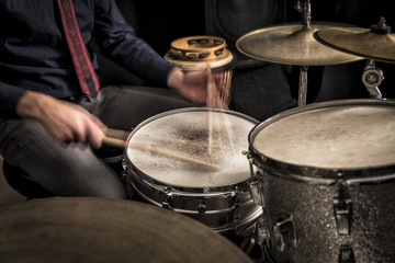 Fototapeta na wymiar Drummer rolling on snare, closeup, motion blur
