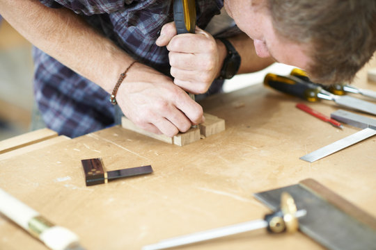 Man working in carpentry workshop, close-up