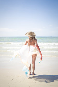 Beautiful woman enjoys the beach