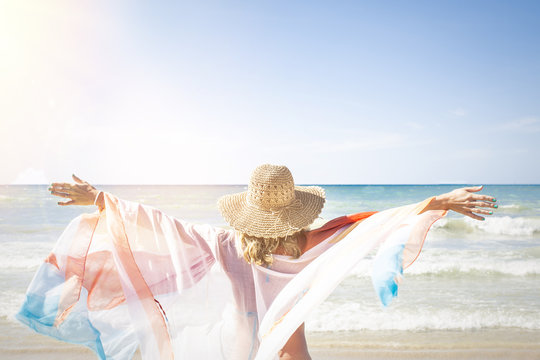 Beautiful woman enjoys the beach