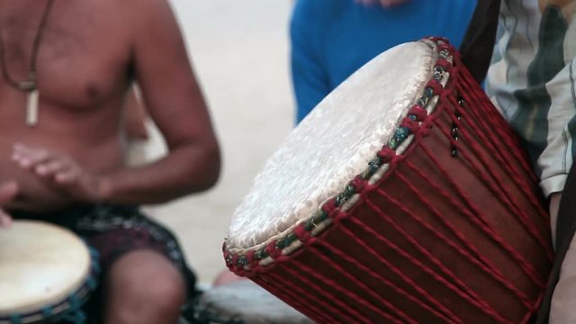 Unidentified man playing on drum 