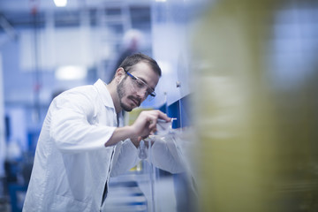 Scientist completing analysis