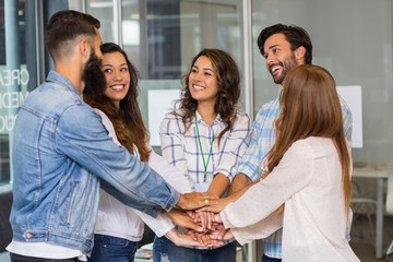 Group of business people forming a hand stack
