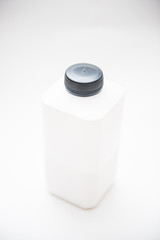 white plastic bottle of milk