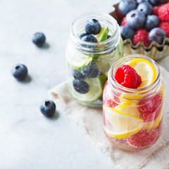 Lemon lime berries fresh infused water detox drink cocktail lemonade