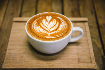 cup of art latte of cappuccino coffee in retro style.