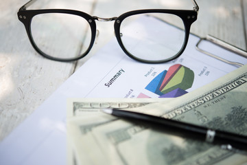 Money and work stuff at workplace.