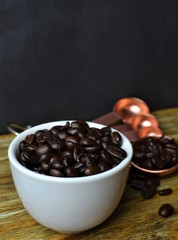 White coffee cup with coffee beans