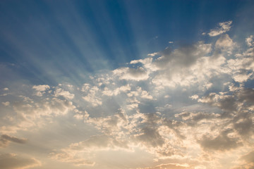 Obraz premium Sun beam in golden Clouds. Soft background of blue sky before a sunrise