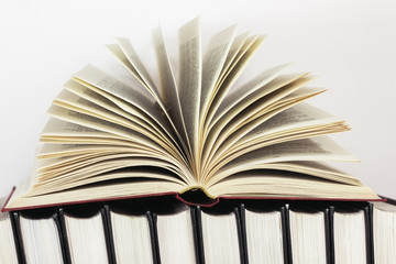 Open book, flipping pages on a white background