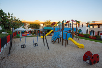 Playground with slide and swing at dawn
