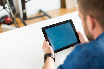 Business man holding a digital tablet