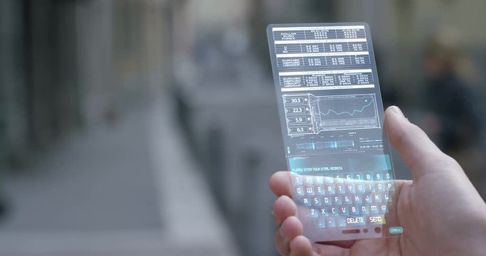 A businessman in the city, use the transparent phone with latest technology security code fingerprint. Concept: technology, business, security and internet banking, future