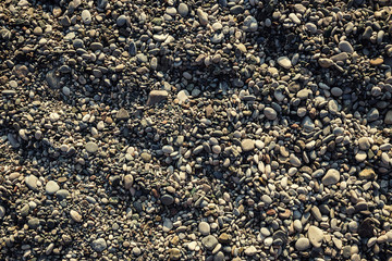 stones and sea,Pebble beach texture,wall pattern of gravel stone,pebbles on the beach as background,Gray sea pebbles on sand background,travel concept,Turkey,Florida,Miami
