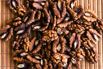 Raw walnuts on brown cover