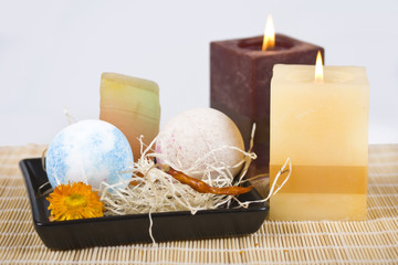 Soaps and two burning candles