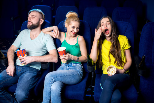 Friends Sleeping During Boring Film In The Cinema