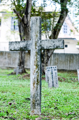 Old grey tombstones. Cemetery in Malaysia