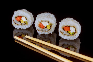 Maki sushi over black background sashimi sush