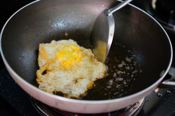 Chef frying pan with cooked egg