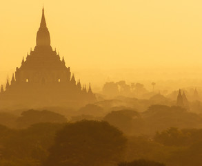 Outlines of an ancient Buddhist temples in Bagan, Myanmar in the morning mist