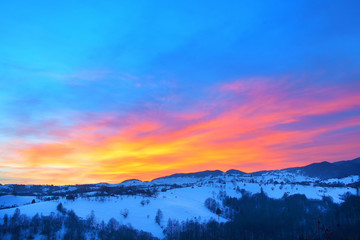 Majestic sunset in the mountains landscape. Dramatic sky. Carpathian, Romania, Europe.