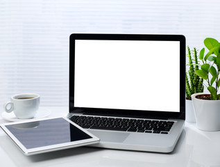 Laptop and digital tablet on desk