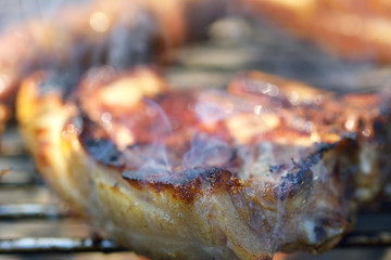 Grilled pork steak on the grill