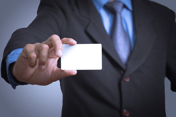 businessman holding a credit card