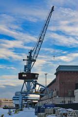 Fototapeta na wymiar Old alone gantry crane at harbour