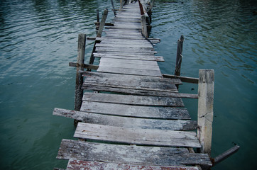 Fototapeta premium Wooden pier on the sea background
