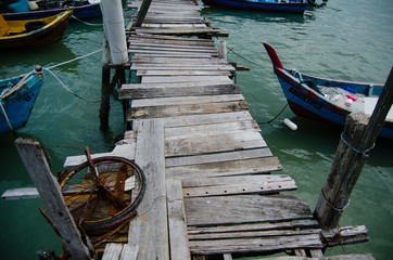 Wooden pier on the sea background