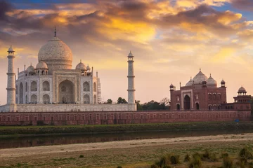 Papier Peint photo Monument artistique Historic Taj Mahal at sunset as viewed from Mehtab Bagh. Taj Mahal a white marble mausoleum designated as the UNESCO World heritage site.