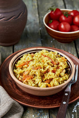 Pilaf with beef, carrots, onions, garlic, pepper and cumin. A traditional dish of Asian cuisine.