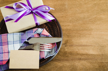 Festive Table Setting with Postcard and Present.