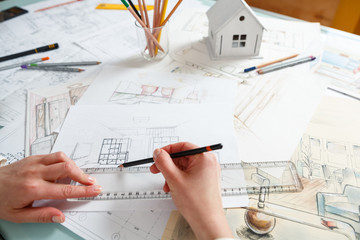 Designer works with hand drawing of interior