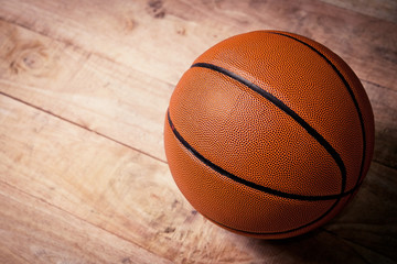 A basketball on a wood