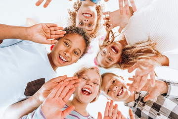 Happy children waving