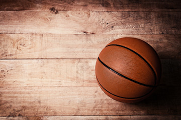 A basketball on a wood